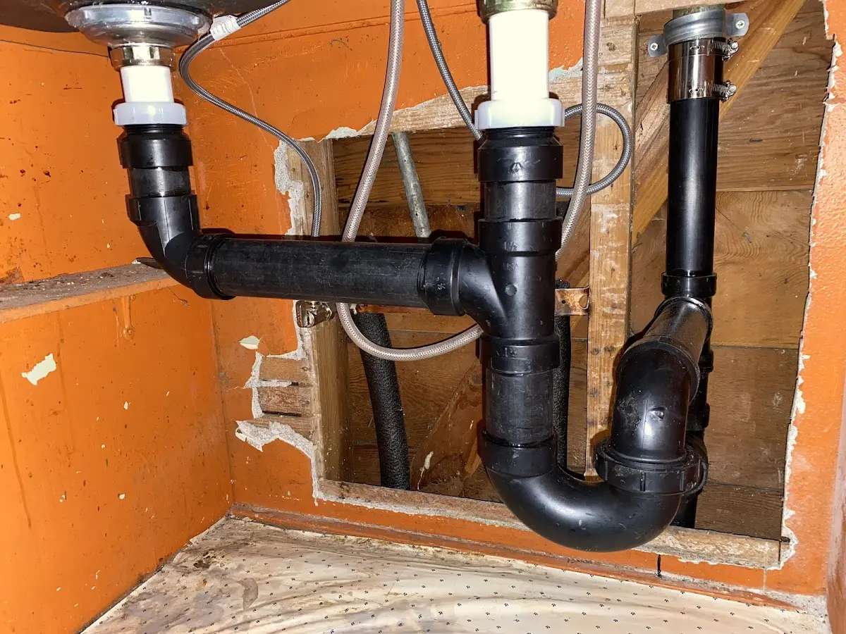 Professional Garbage Disposal Repair equipment and tools on the job in Dawson